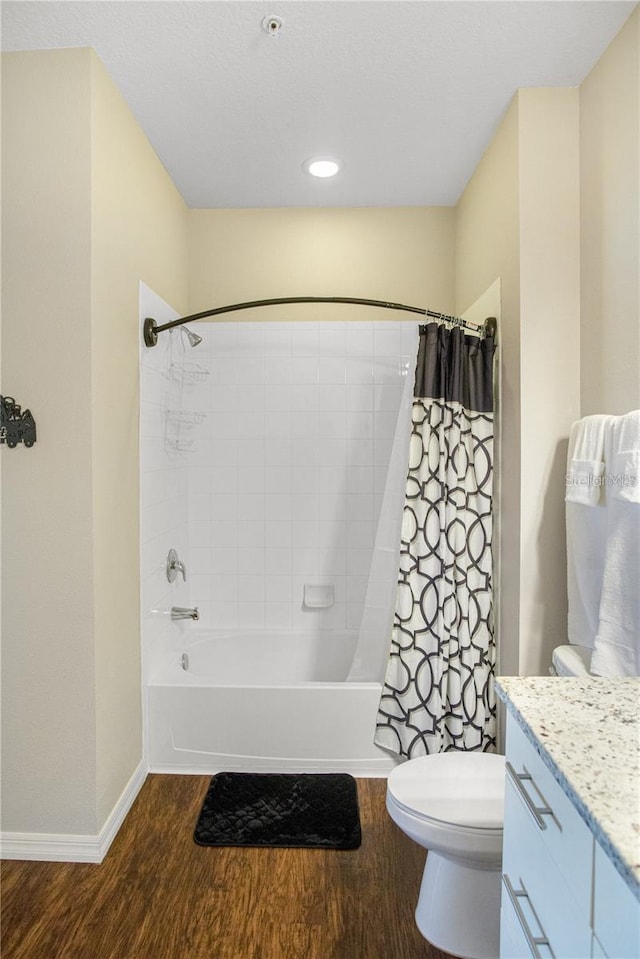 full bathroom featuring toilet, vanity, shower / bath combination with curtain, and hardwood / wood-style flooring