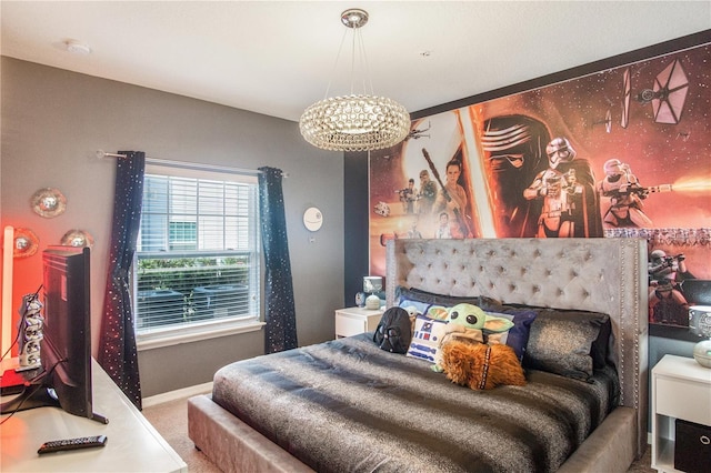 bedroom with a chandelier and carpet