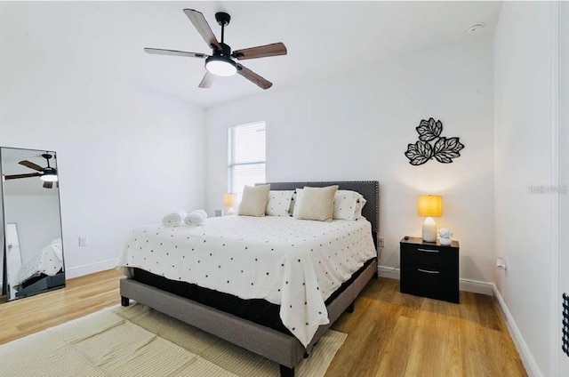 bedroom featuring ceiling fan and hardwood / wood-style flooring