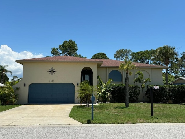 mediterranean / spanish house with a front yard