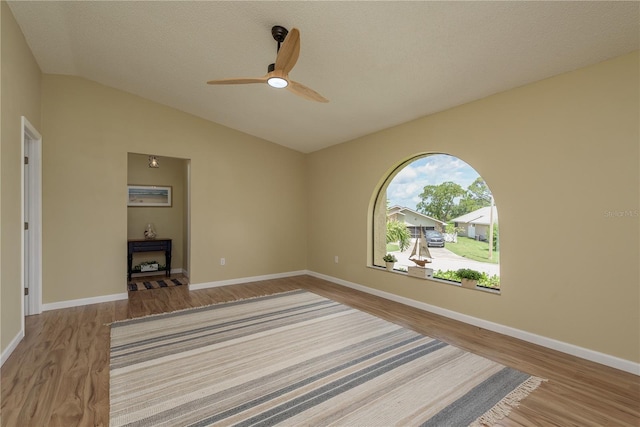 4514 Dewey Dr, New Port Richey, FL 34652 - unfurnished room featuring wood finished floors, ceiling fan, lofted ceiling, and baseboards