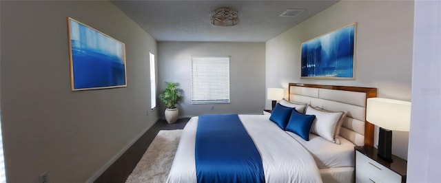 4514 Dewey Dr, New Port Richey, FL 34652 - bedroom featuring baseboards and wood finished floors
