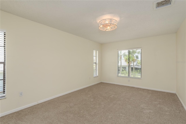 4514 Dewey Dr, New Port Richey, FL 34652 - unfurnished room featuring carpet flooring and baseboards