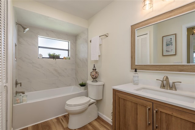 4514 Dewey Dr, New Port Richey, FL 34652 - bathroom with toilet, wood finished floors, shower / washtub combination, vanity, and baseboards