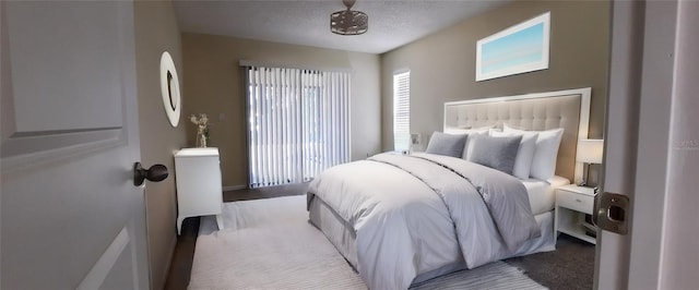 4514 Dewey Dr, New Port Richey, FL 34652 - carpeted bedroom with a textured ceiling and baseboards