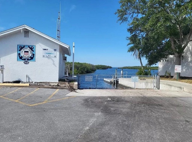 4514 Dewey Dr, New Port Richey, FL 34652 - view of car parking with fence and a gate