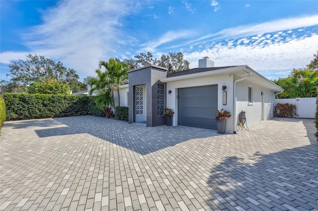 view of side of home with a garage