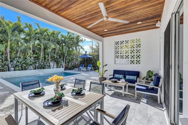 view of patio with outdoor lounge area and ceiling fan