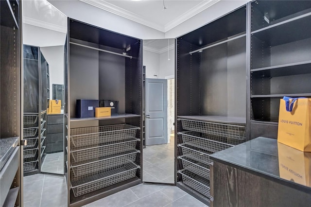 spacious closet with light tile patterned floors