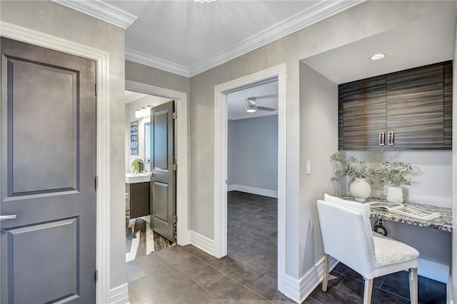 tiled office space with ceiling fan and ornamental molding