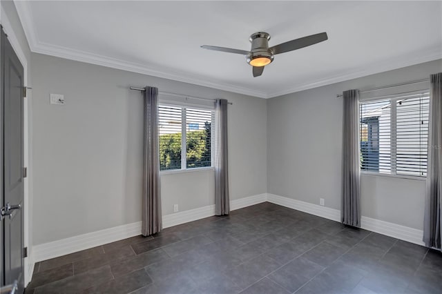 tiled empty room with ceiling fan and ornamental molding