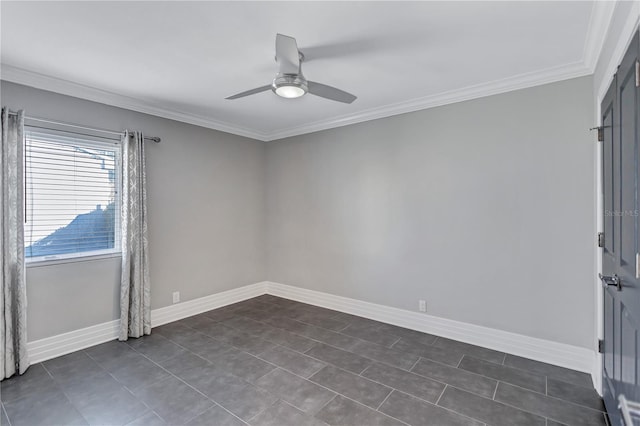 unfurnished room featuring ceiling fan, dark tile patterned floors, and crown molding