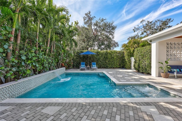 view of pool featuring a patio area and pool water feature