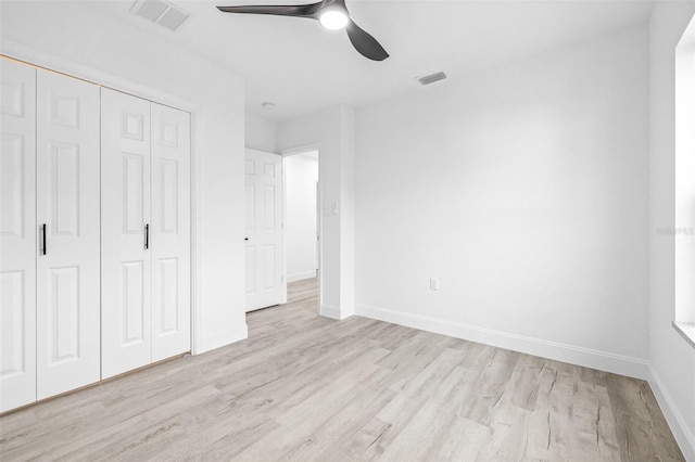 unfurnished bedroom with a closet, ceiling fan, and light hardwood / wood-style floors