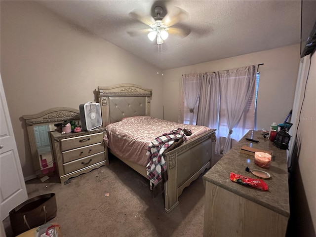 carpeted bedroom with ceiling fan and a textured ceiling