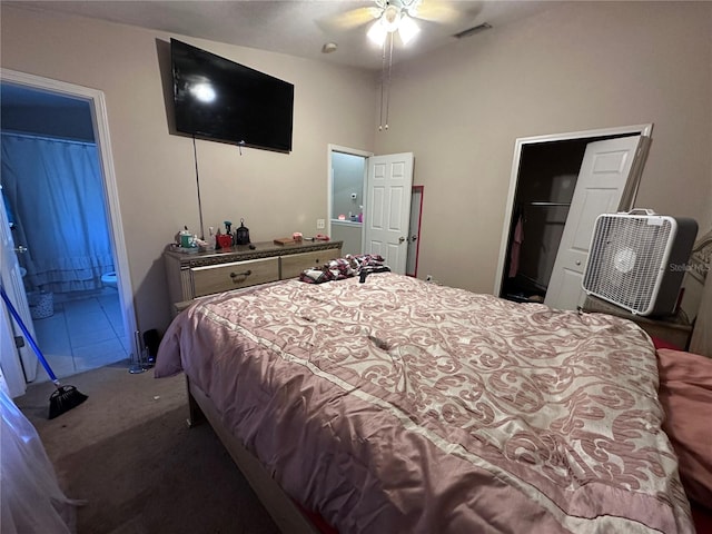 bedroom featuring connected bathroom, ceiling fan, a closet, and carpet floors