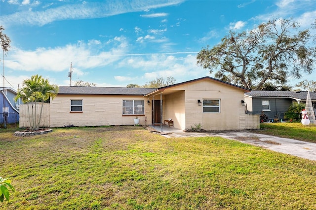 ranch-style house with a front lawn