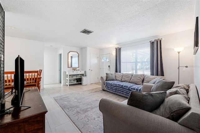 living room with a textured ceiling