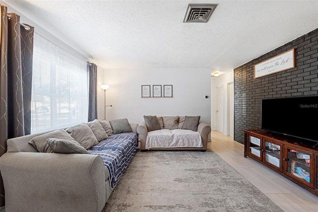 living room with a textured ceiling