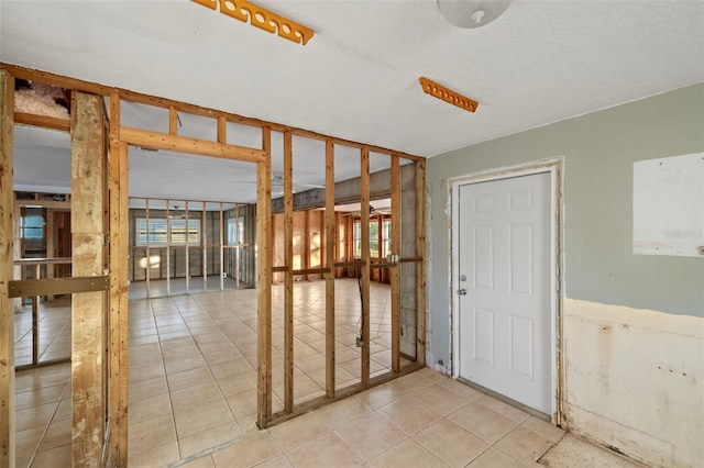 interior space featuring a textured ceiling