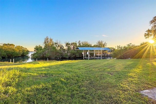 yard at dusk with a water view