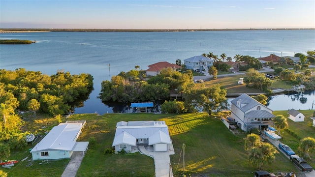 aerial view at dusk with a water view