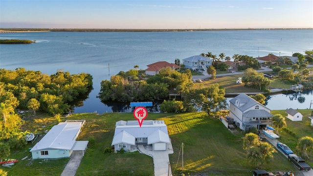 aerial view at dusk with a water view