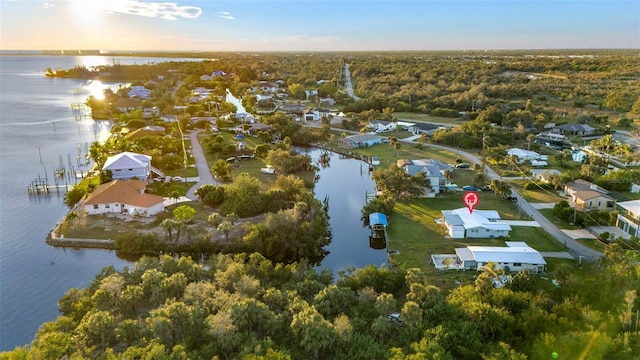 aerial view at dusk with a water view