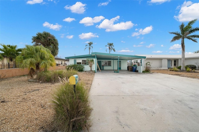 view of front facade with a carport