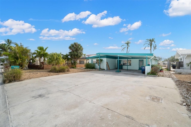 exterior space featuring a carport