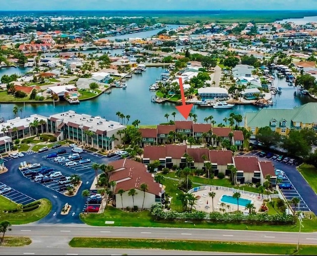 birds eye view of property with a water view