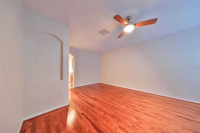 unfurnished room featuring ceiling fan and light hardwood / wood-style flooring