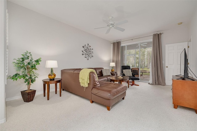 carpeted living room featuring ceiling fan