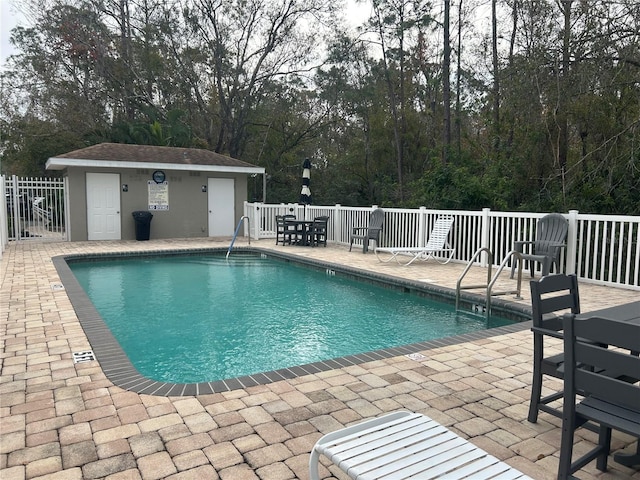 view of swimming pool with a patio area