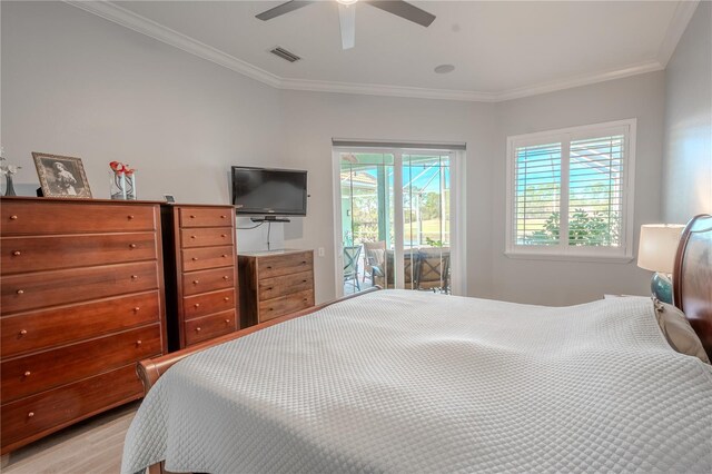 12113 Marblehead Dr, Tampa, FL 33626 - bedroom with access to exterior, ornamental molding, ceiling fan, and light wood-style flooring