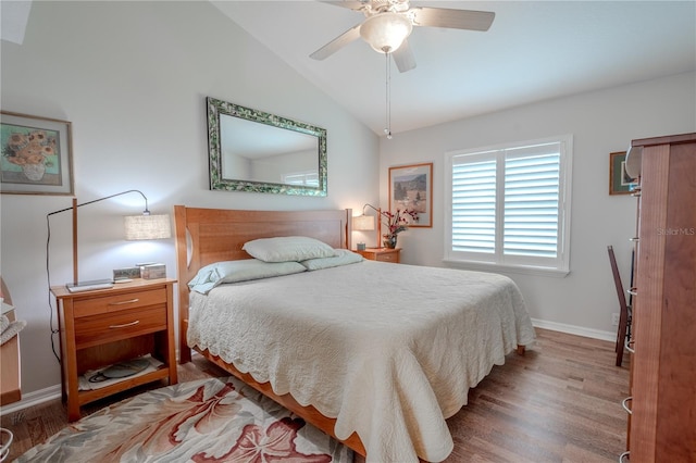 12113 Marblehead Dr, Tampa, FL 33626 - bedroom with lofted ceiling, wood finished floors, baseboards, and a ceiling fan
