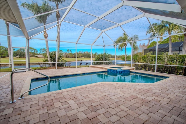 12113 Marblehead Dr, Tampa, FL 33626 - view of pool with a patio, a pool with connected hot tub, a water view, and a lanai