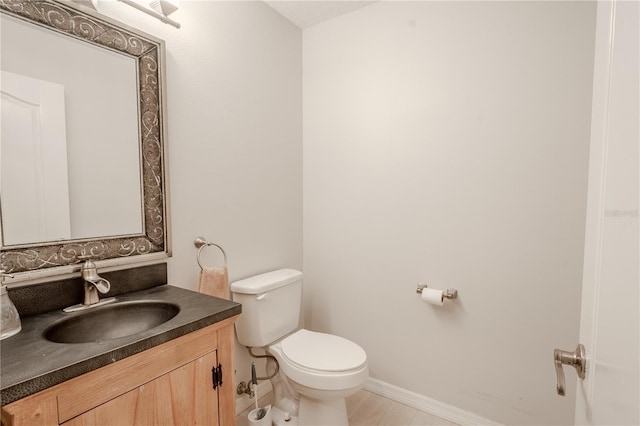12113 Marblehead Dr, Tampa, FL 33626 - bathroom featuring toilet, vanity, and baseboards
