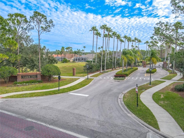 12113 Marblehead Dr, Tampa, FL 33626 - view of asphalt street with sidewalks, curbs, traffic signs, and street lights