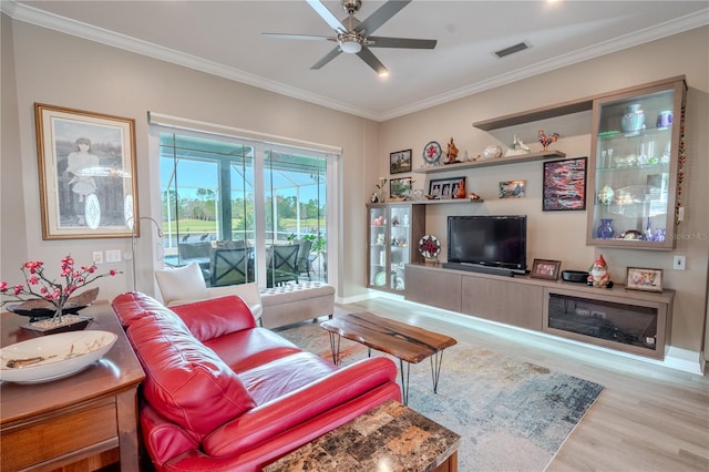 12113 Marblehead Dr, Tampa, FL 33626 - living area featuring wood finished floors, ornamental molding, a ceiling fan, and baseboards