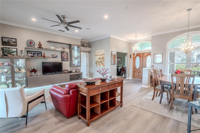 12113 Marblehead Dr, Tampa, FL 33626 - living room featuring a chandelier, wood finished floors, ornamental molding, a ceiling fan, and recessed lighting