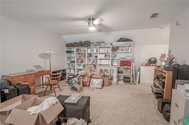 12113 Marblehead Dr, Tampa, FL 33626 - living area featuring ceiling fan, carpet flooring, a textured ceiling, a desk, and lofted ceiling