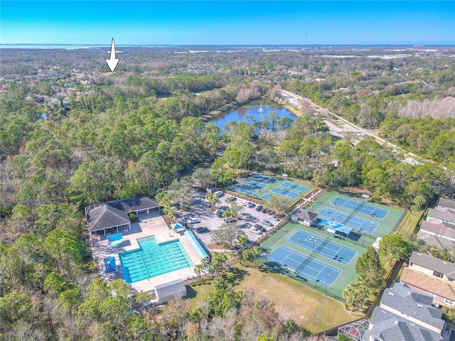 12113 Marblehead Dr, Tampa, FL 33626 - aerial view of property and surrounding area with a pool, a forest, and a large body of water