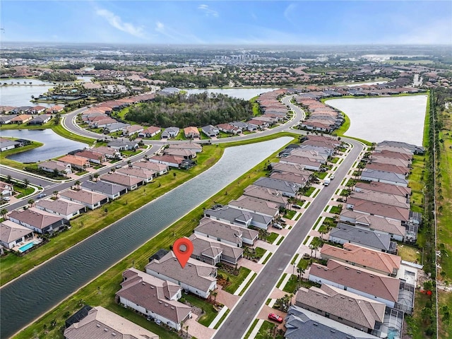 birds eye view of property featuring a water view