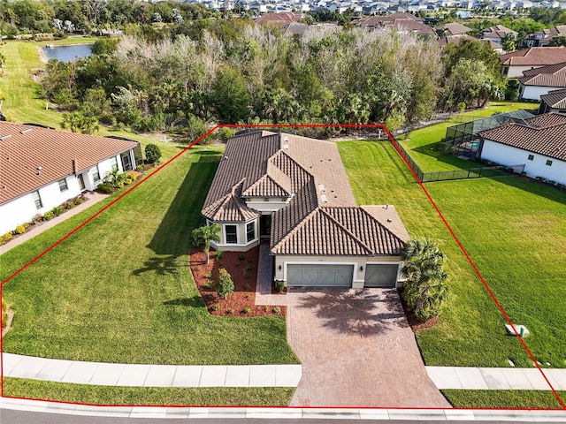 birds eye view of property with a water view