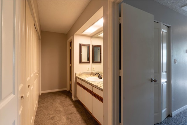 bathroom featuring vanity and a textured ceiling