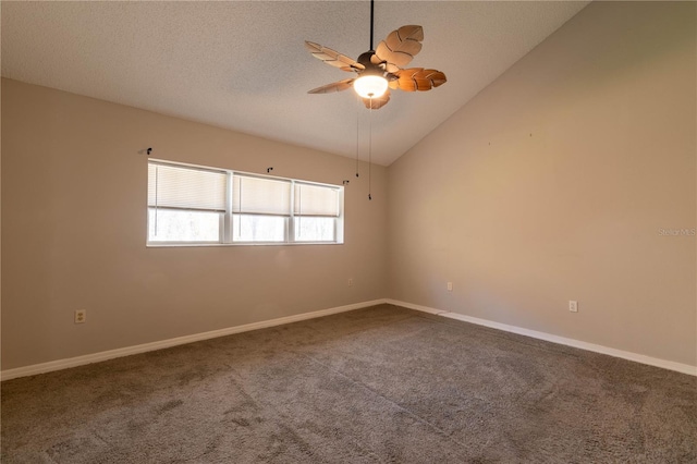 carpeted spare room with ceiling fan and high vaulted ceiling