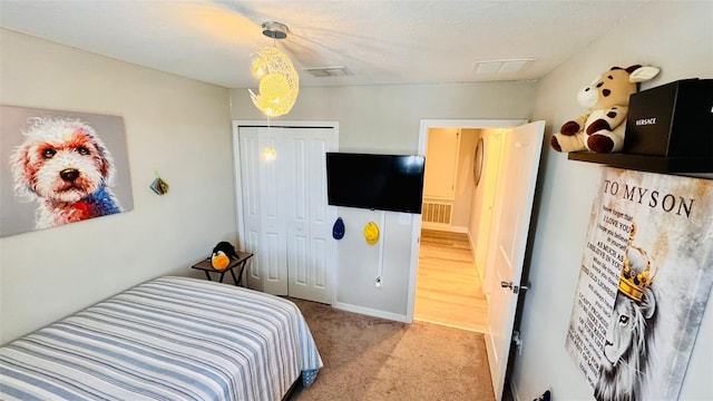 carpeted bedroom with a closet