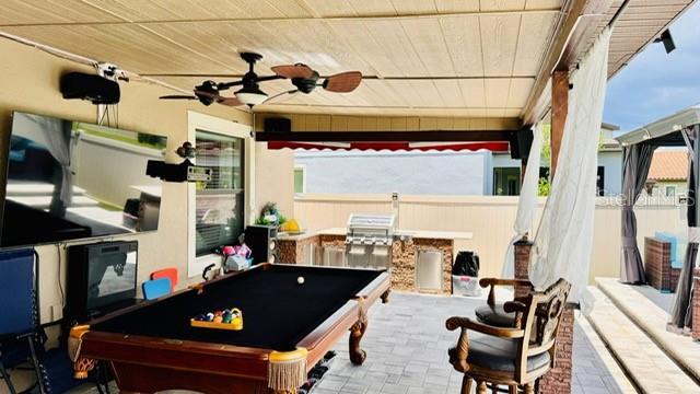 game room with ceiling fan, wooden ceiling, and billiards