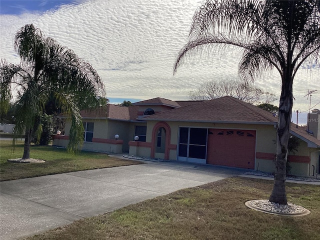 ranch-style home with a front lawn and a garage